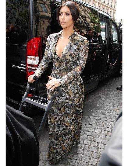 kim-kardashian-and-kanye-west-out-and-about-in-paris-france-23-may-2014-kim-kardashian-and-kanye-west-leaving-a-private-address-to-go-to-the-castle-of-rex_GA